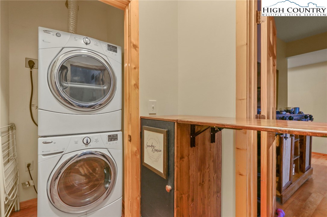195 Omerta Lane Boone, NC 28607 - Photo 40 of 50 a view of a hallway with washer and dryer