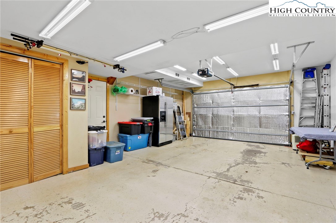 195 Omerta Lane Boone, NC 28607 - Photo 41 of 50 a room with a bed and flat screen tv