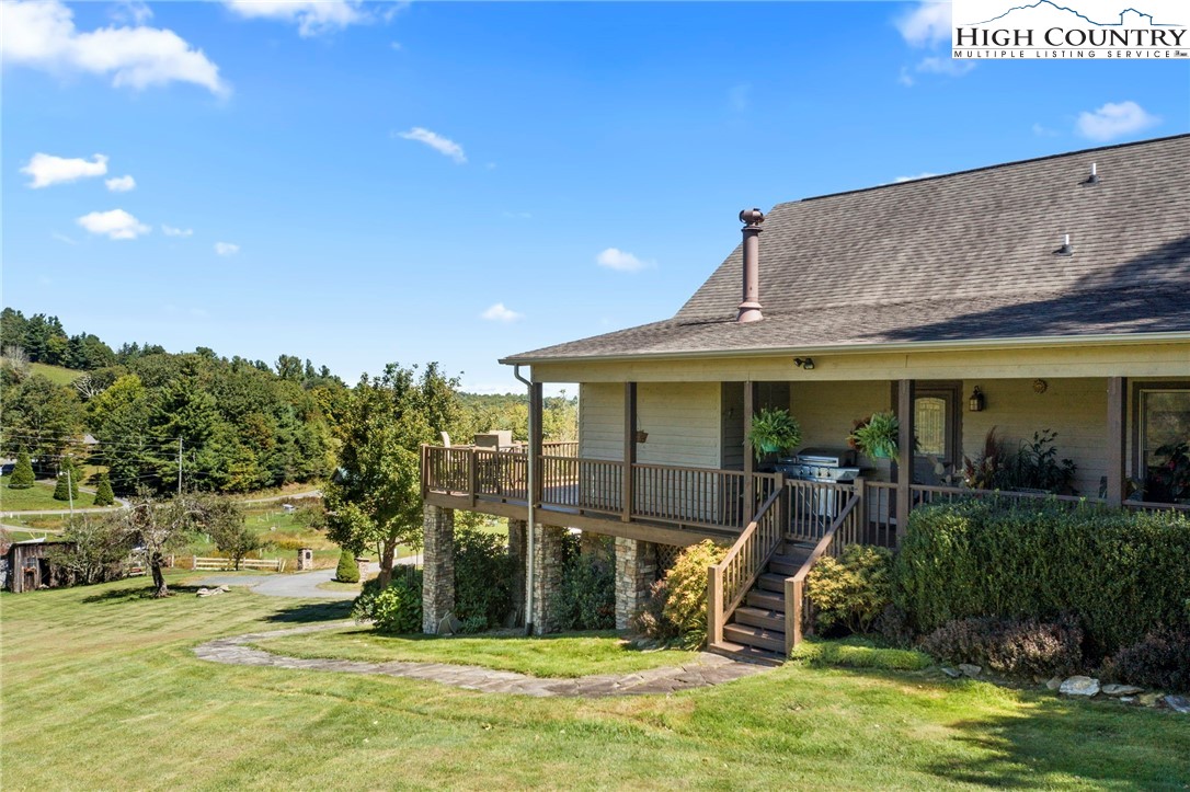 195 Omerta Lane Boone, NC 28607 - Photo 42 of 50 a view of a house with swimming pool and sitting area