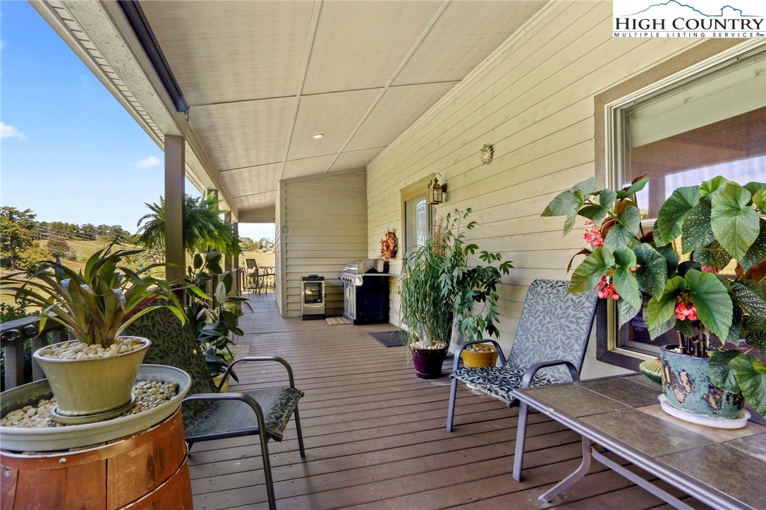 195 Omerta Lane Boone, NC 28607 - Photo 43 of 50 a vase of flowers sitting on a wooden floor