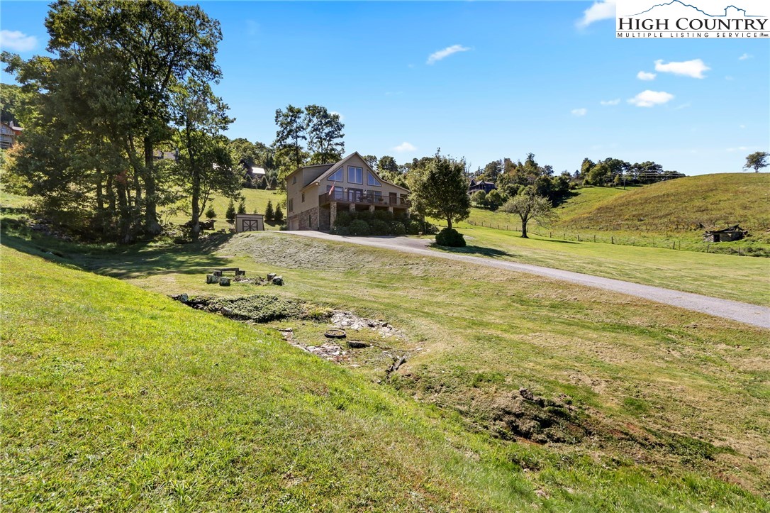 195 Omerta Lane Boone, NC 28607 - Photo 10 of 50 a view of a yard with an trees
