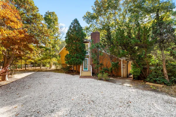 a view of a house with a tree