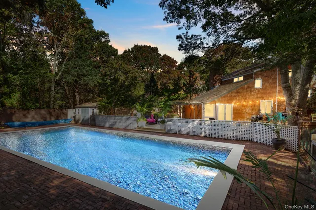 a view of a backyard with sitting area