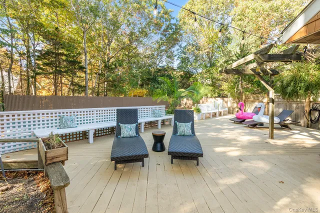 swimming pool view with a seating space