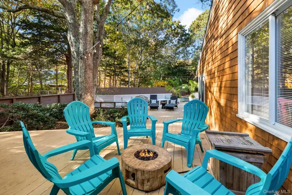 a view of a patio with chairs and table on the patio