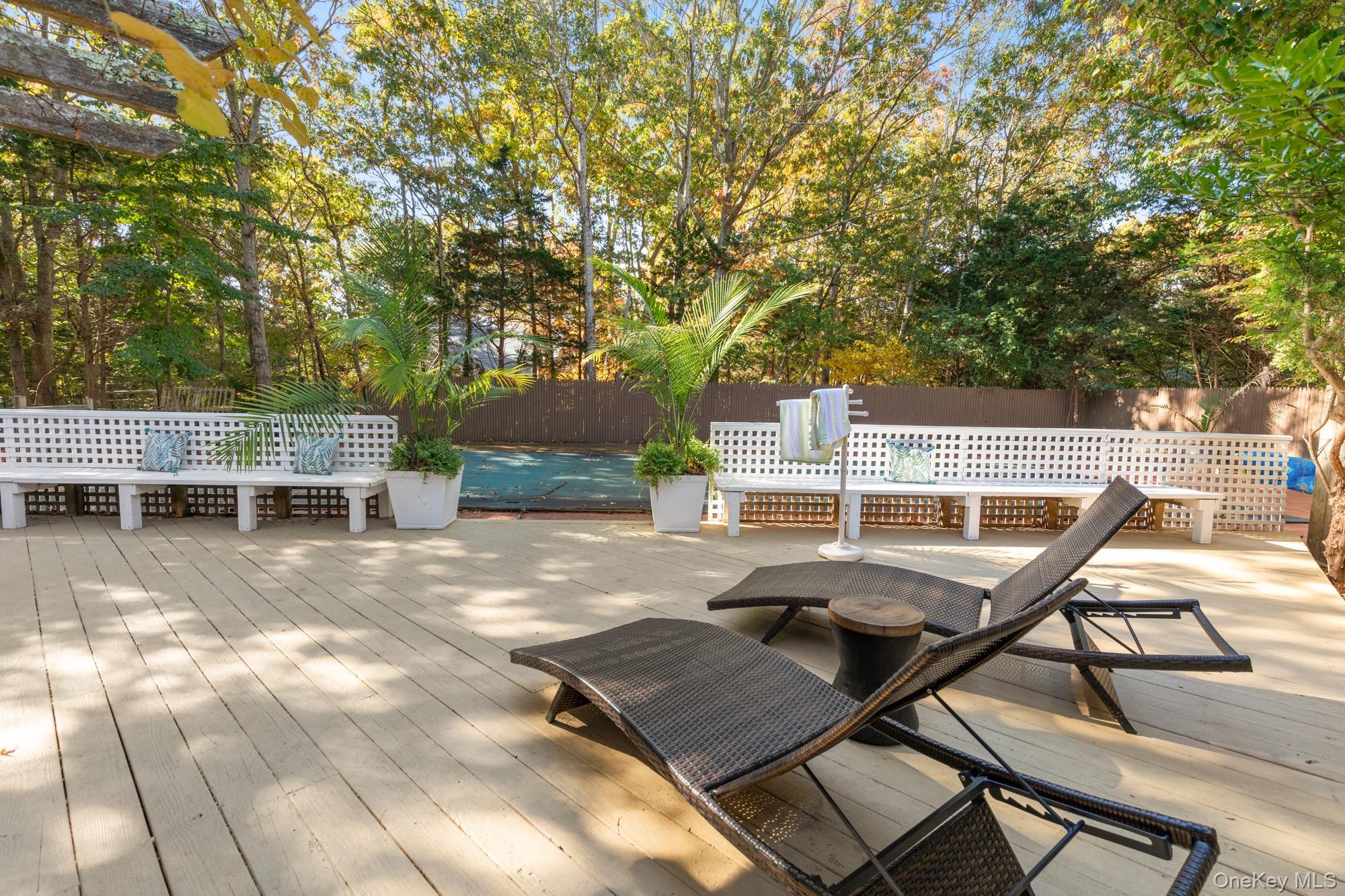 20 Norfolk Drive Springs, NY 11937 - Photo 23 of 23 a view of a patio with chairs and table on the patio