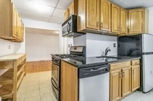 a kitchen with stainless steel appliances granite countertop a stove and a sink