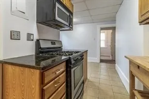 a kitchen with a stove and a microwave