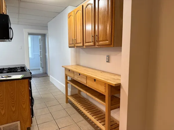 a kitchen with a stove and a microwave