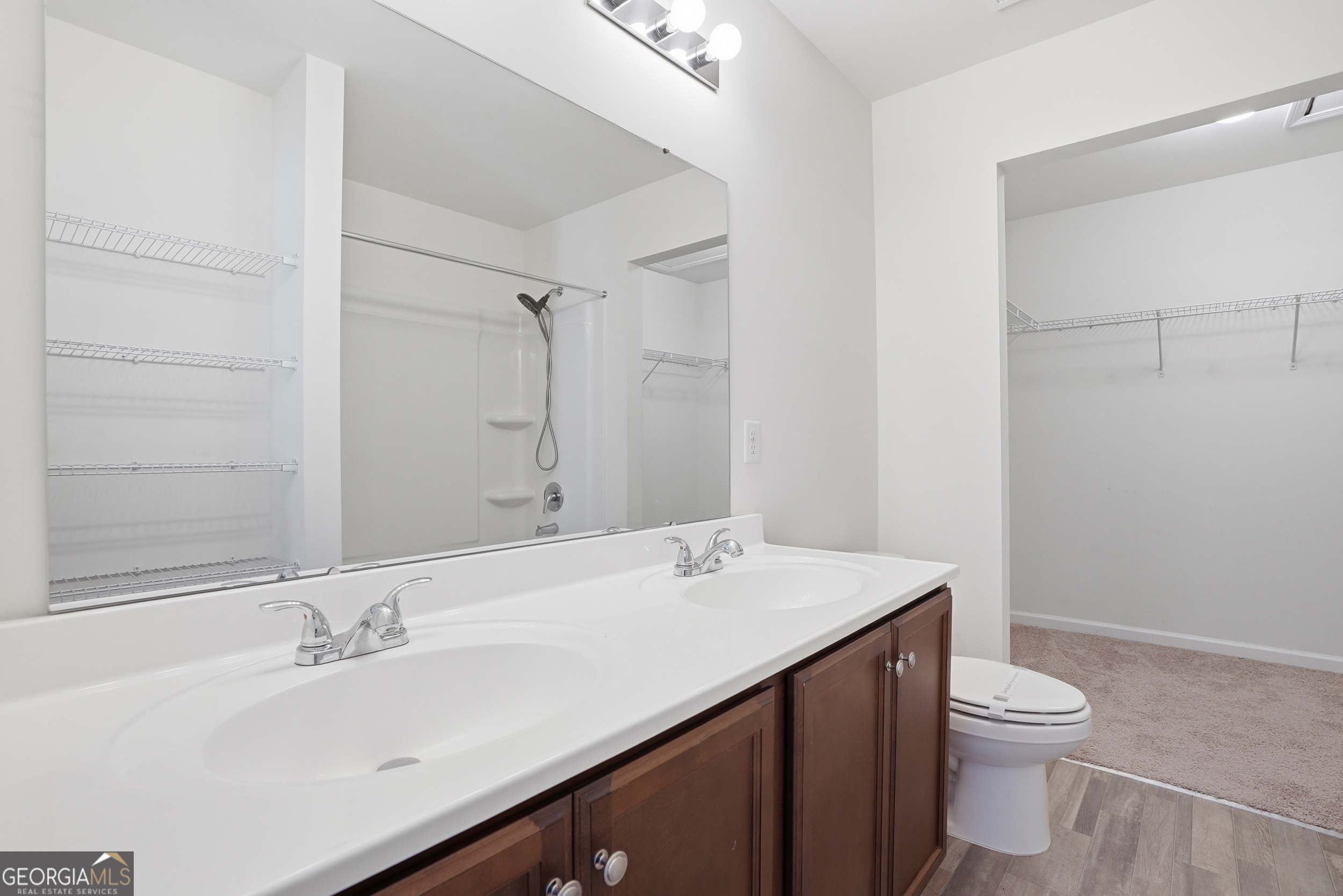 225 Rendell Lane Hinesville, GA 31313 - Photo 23 of 33 a bathroom with a sink a toilet and a mirror