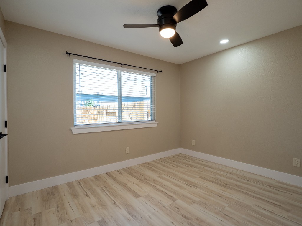 8314 Bowling Green Drive, Unit B Austin, TX 78757 - Photo 12 of 22 Unfurnished room with light wood-style flooring, ceiling fan, and recessed lighting