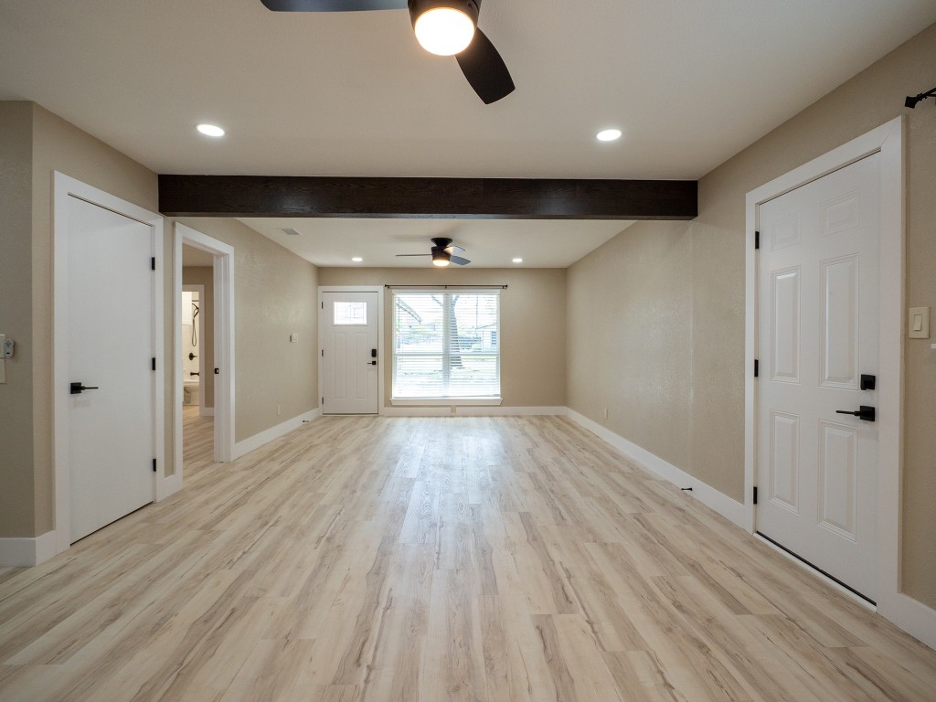 8314 Bowling Green Drive, Unit B Austin, TX 78757 - Photo 15 of 22 Unfurnished living room featuring beam ceiling, light wood finished floors, recessed lighting, and a ceiling fan