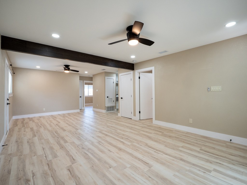 8314 Bowling Green Drive, Unit B Austin, TX 78757 - Photo 16 of 22 Spare room with recessed lighting, ceiling fan, light wood-style floors, and beamed ceiling