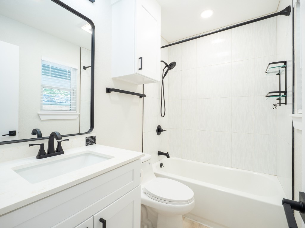 8314 Bowling Green Drive, Unit B Austin, TX 78757 - Photo 20 of 22 Bathroom with washtub / shower combination and vanity