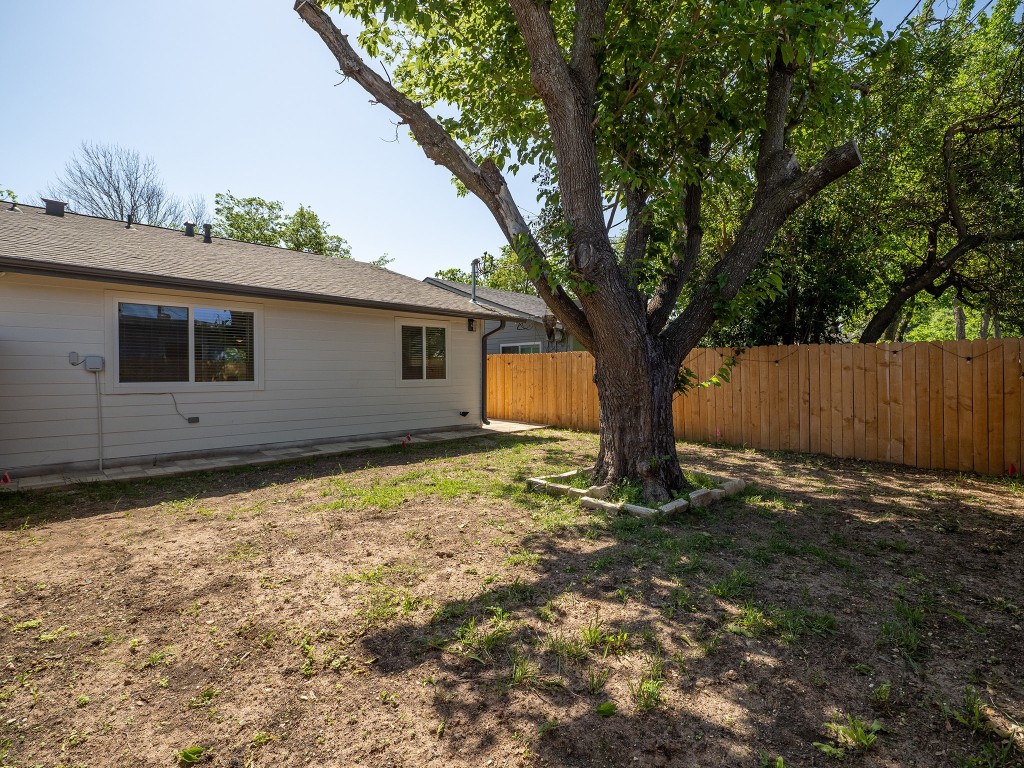 8314 Bowling Green Drive, Unit B Austin, TX 78757 - Photo 10 of 22 Fenced backyard with a patio