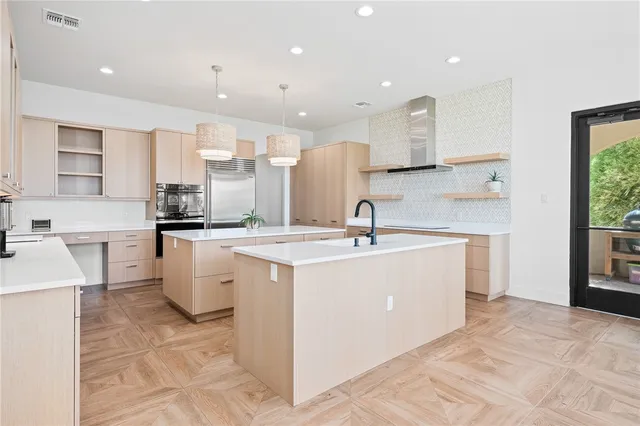 a kitchen with a stove a sink and a refrigerator