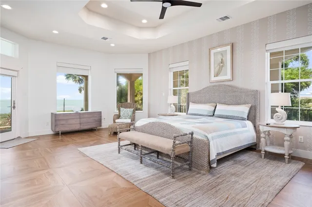 a spacious bathroom with double sink and mirror