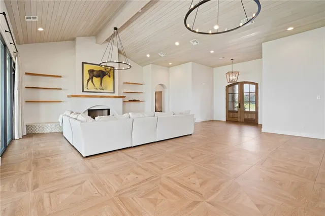 a view of a livingroom with furniture and a flat screen tv