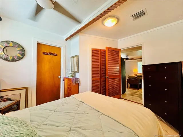 a bedroom with a bed and a dresser