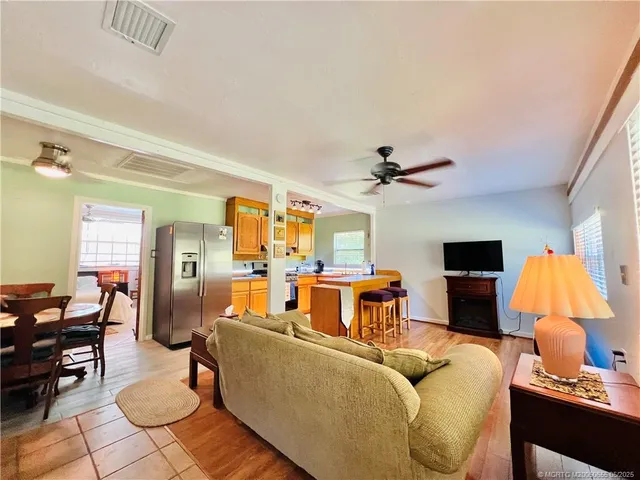 a living room with furniture and a lamp
