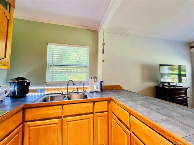 a kitchen with a sink and a window