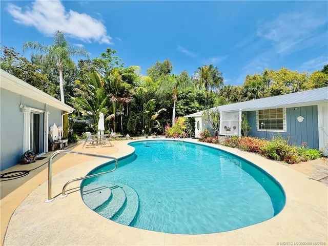a view of a house with swimming pool