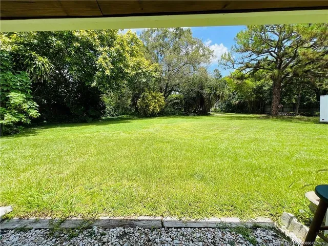 a view of a yard with an outdoor space