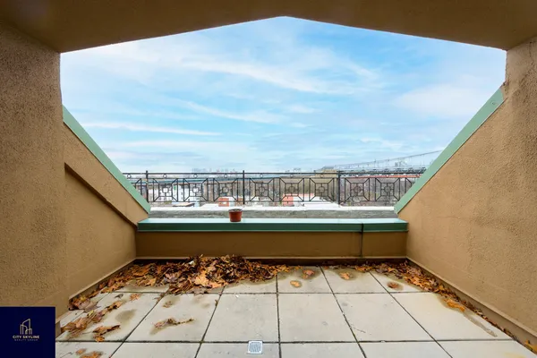 a view of balcony with furniture
