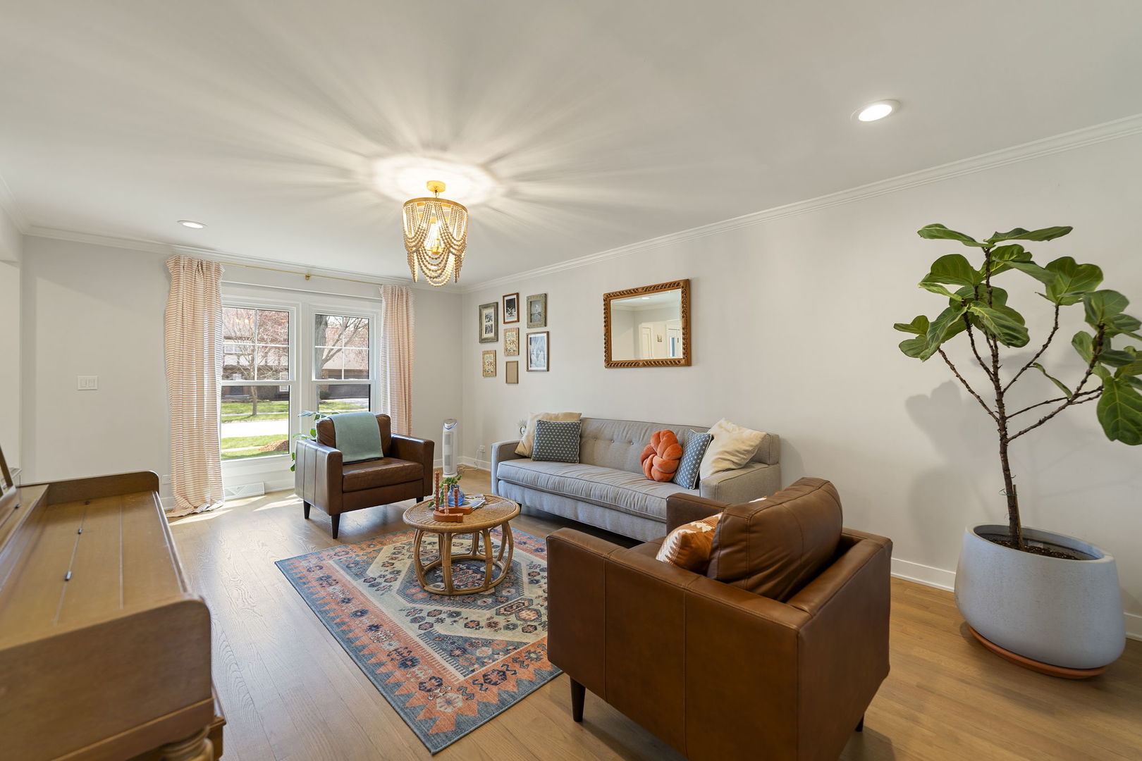 675 Cavalcade Circle Naperville, IL 60540 - Photo 21 of 58 a living room with furniture a chandelier and a window