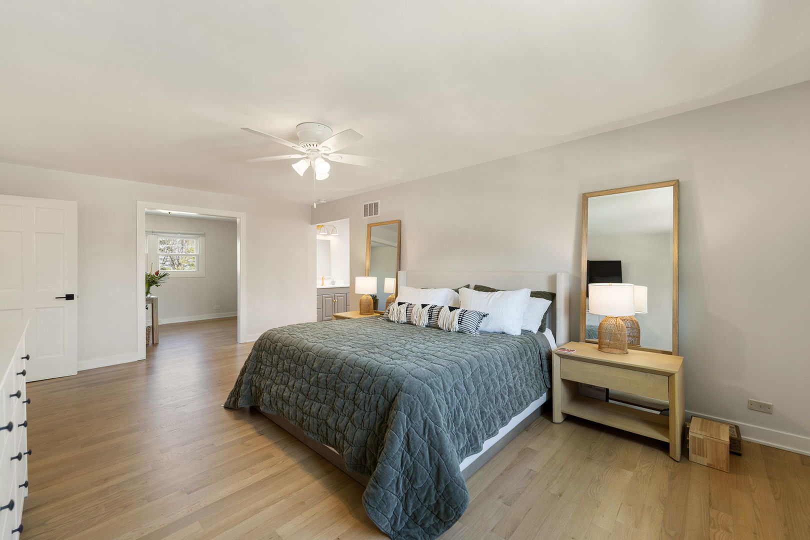 675 Cavalcade Circle Naperville, IL 60540 - Photo 27 of 58 a bedroom with a bed and a chandelier