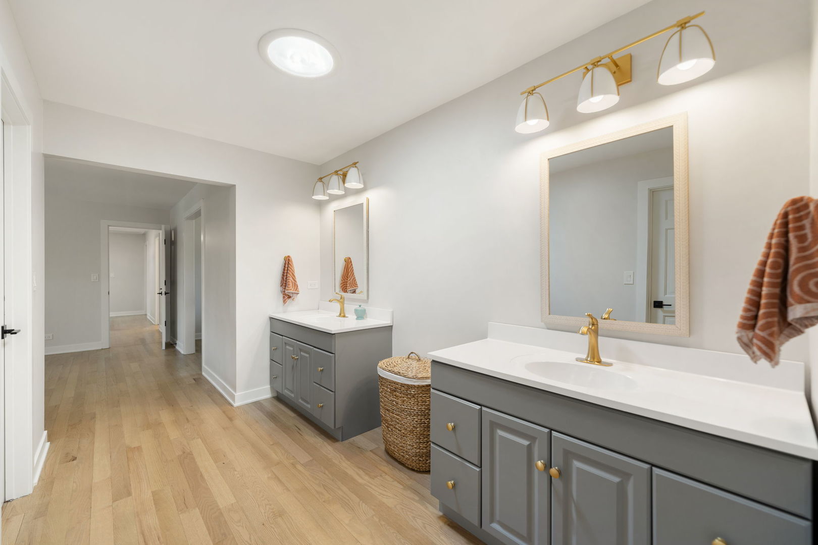 675 Cavalcade Circle Naperville, IL 60540 - Photo 30 of 58 a bathroom with a double vanity sink and a mirror