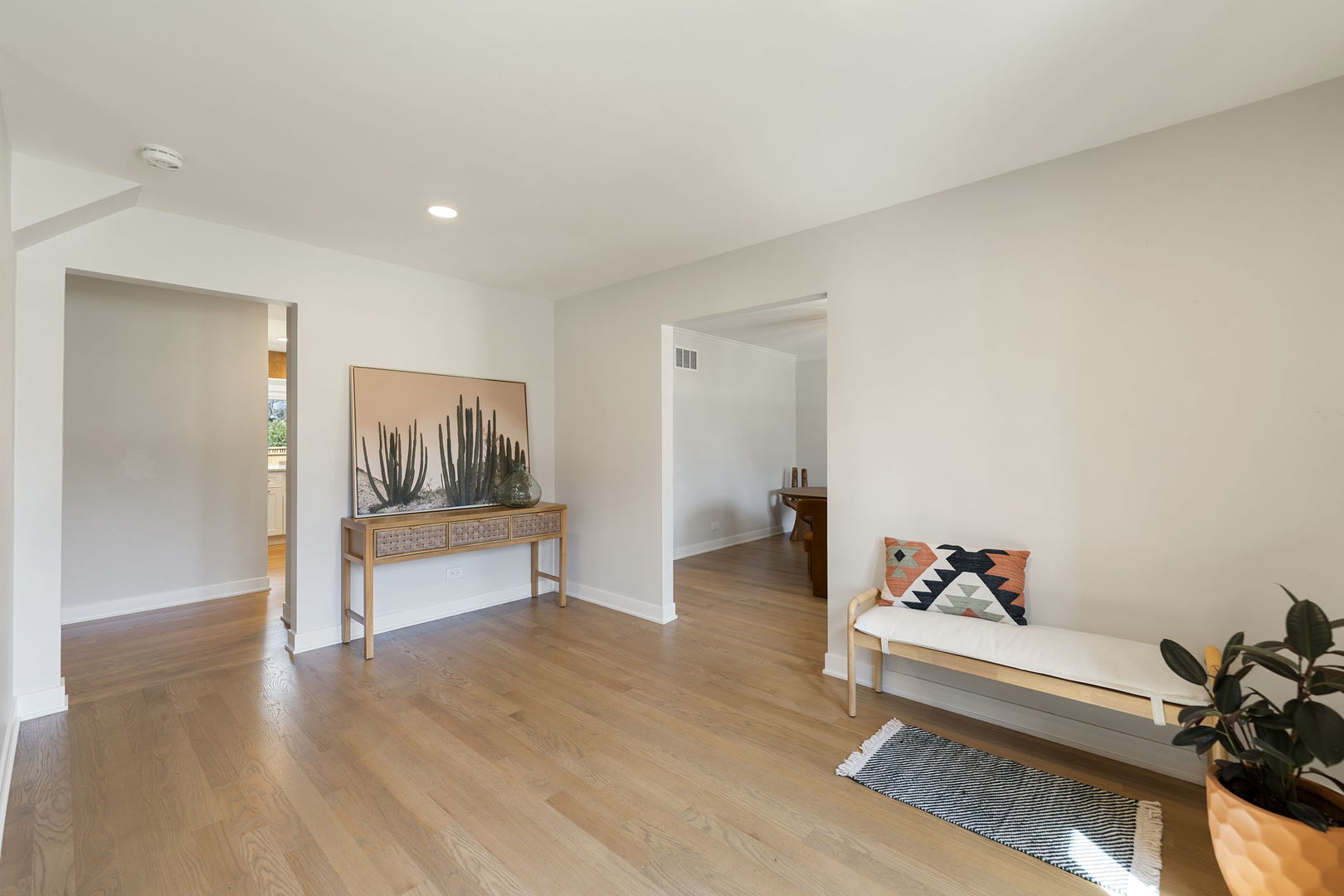 675 Cavalcade Circle Naperville, IL 60540 - Photo 3 of 58 a living room with furniture and a wooden floor