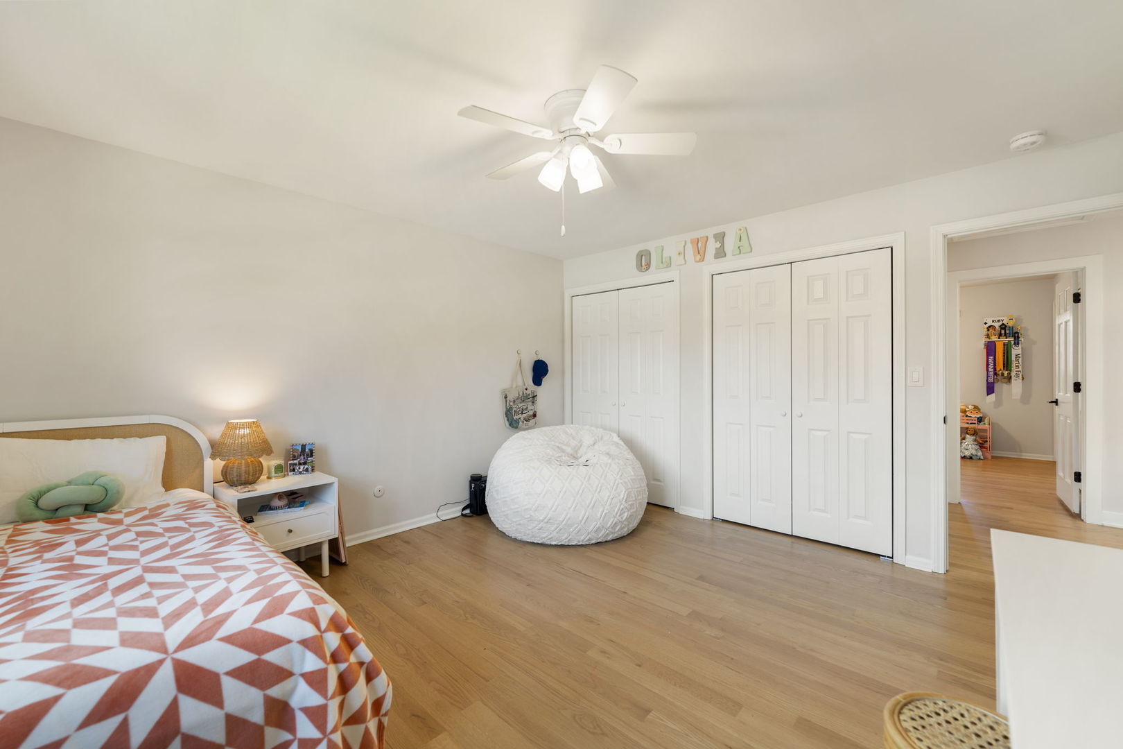 675 Cavalcade Circle Naperville, IL 60540 - Photo 35 of 58 a bedroom with a bed and a chandelier