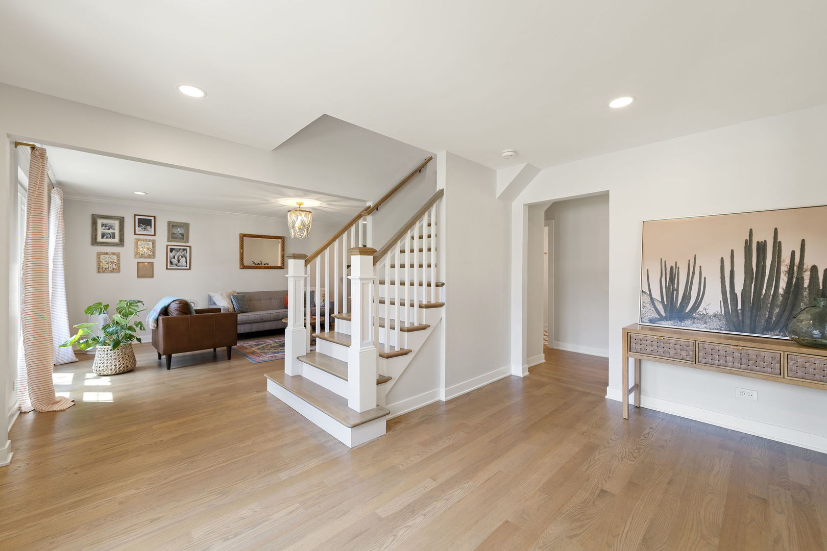 675 Cavalcade Circle Naperville, IL 60540 - Photo 4 of 58 a view of an entryway with wooden floor and windows