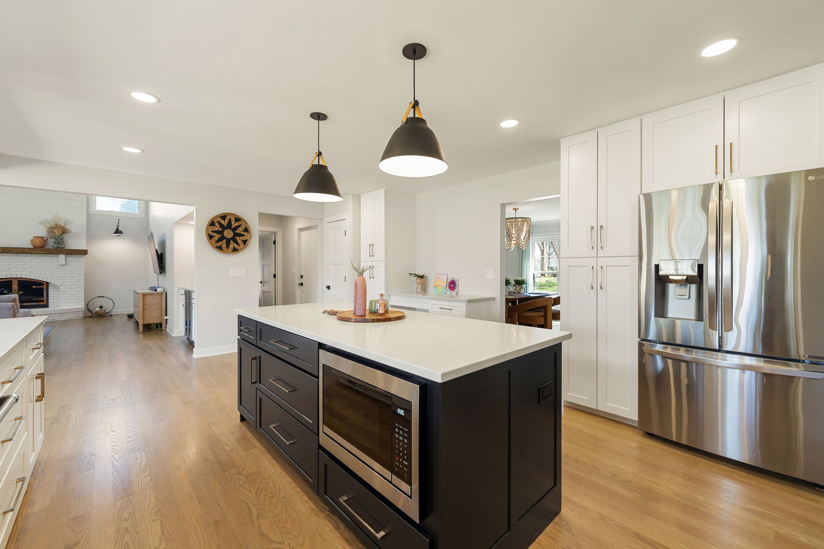 675 Cavalcade Circle Naperville, IL 60540 - Photo 8 of 58 a kitchen with kitchen island a sink stainless steel appliances and wooden floor