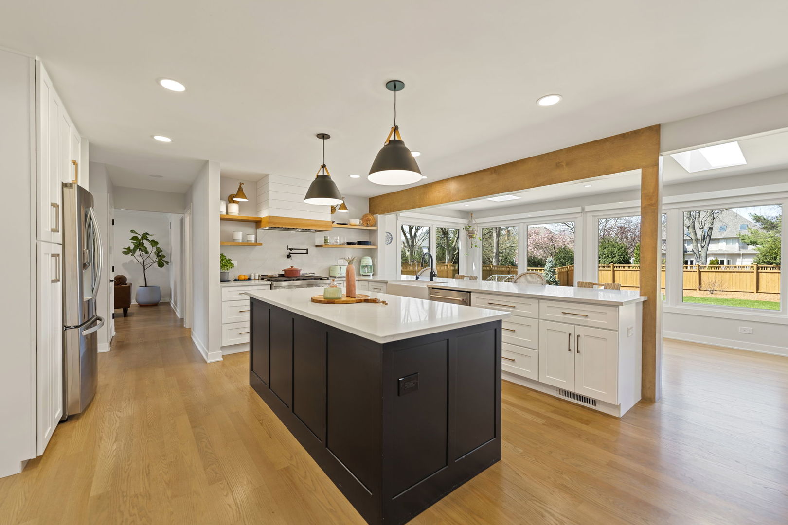 675 Cavalcade Circle Naperville, IL 60540 - Photo 9 of 58 a kitchen with counter top space sink and center island