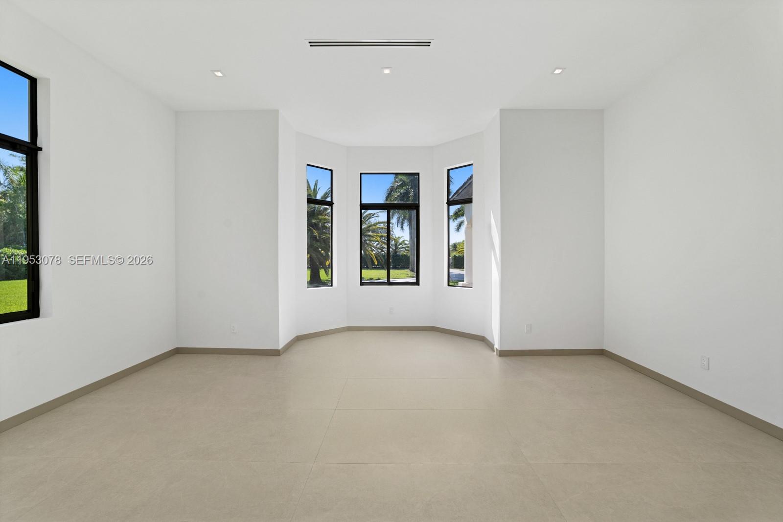 17805 Southwest 158th Street Miami, FL 33187 - Photo 15 of 55 an empty room with windows