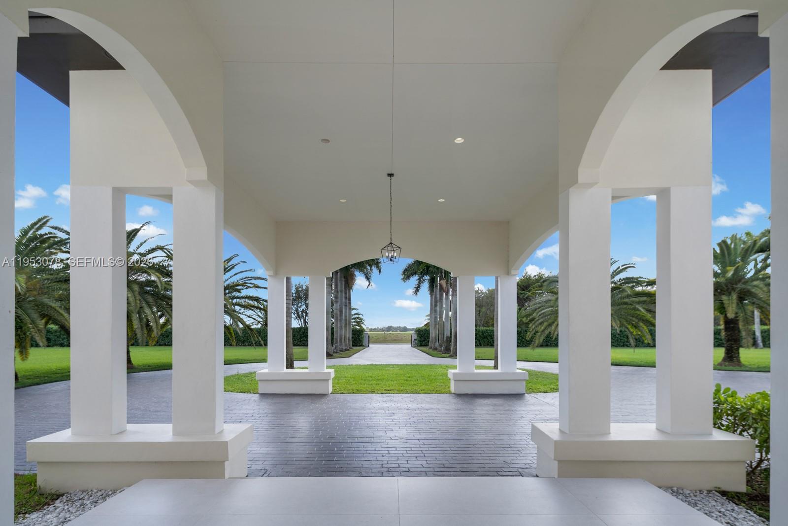 17805 Southwest 158th Street Miami, FL 33187 - Photo 7 of 55 a view of a garden with porch