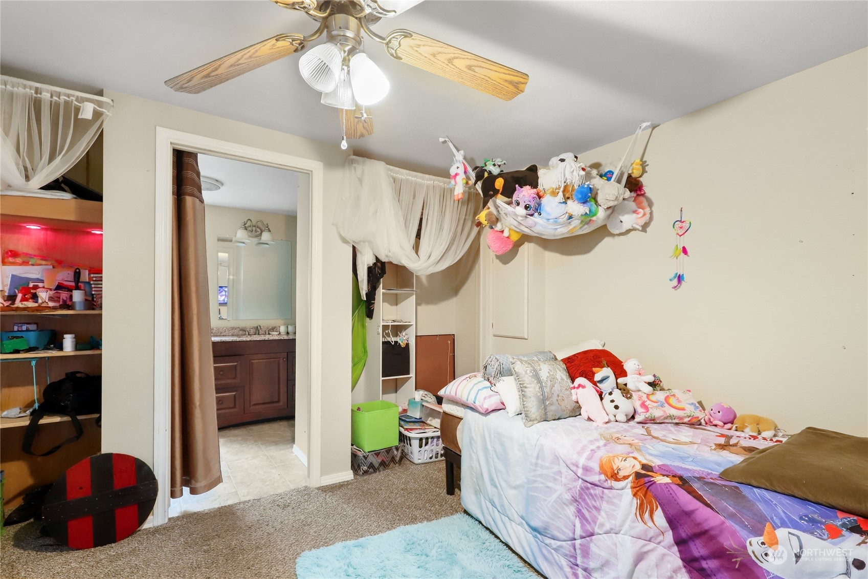 10909 Sidney Road Southwest Port Orchard, WA 98367 - Photo 15 of 34 a bedroom with baby toys and dresser
