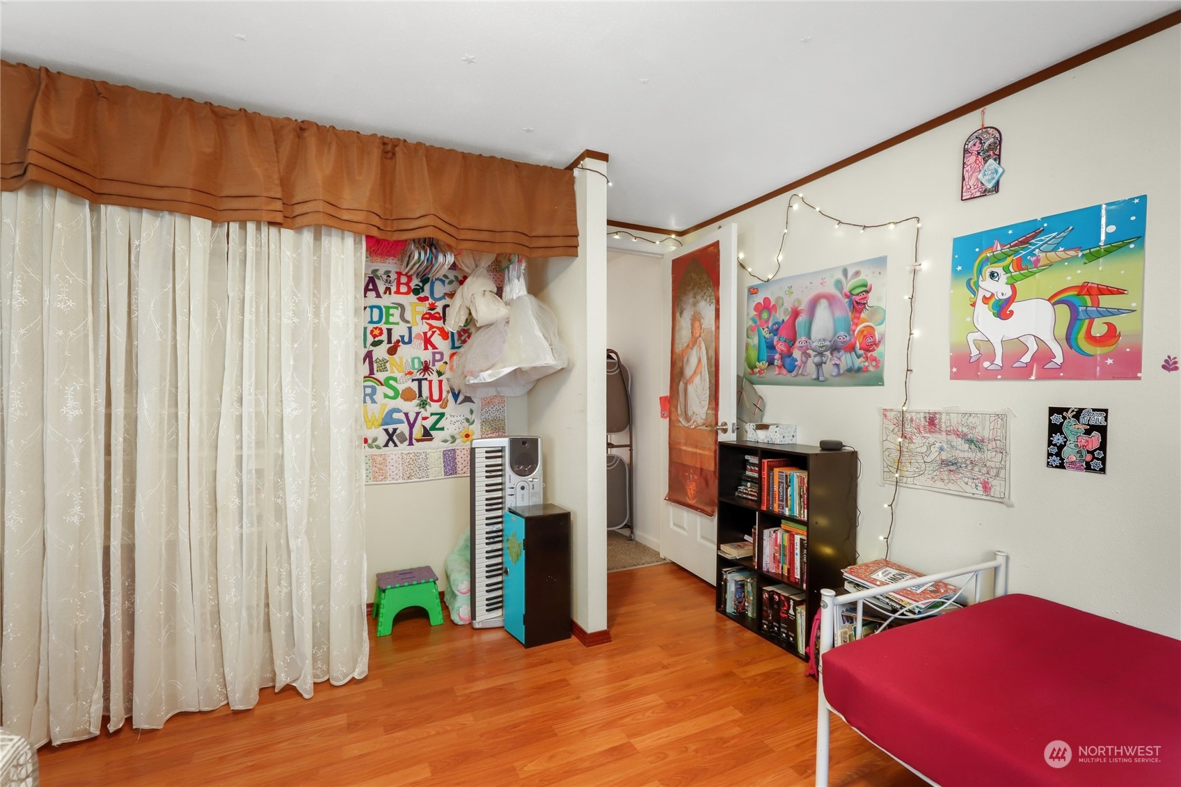 10909 Sidney Road Southwest Port Orchard, WA 98367 - Photo 20 of 34 a bed room with a bed and a book shelf