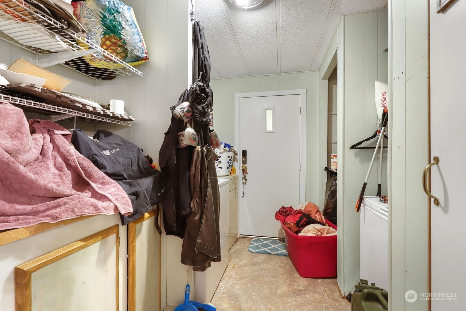 10909 Sidney Road Southwest Port Orchard, WA 98367 - Photo 23 of 34 a view of walk in closet with clothes and shoes