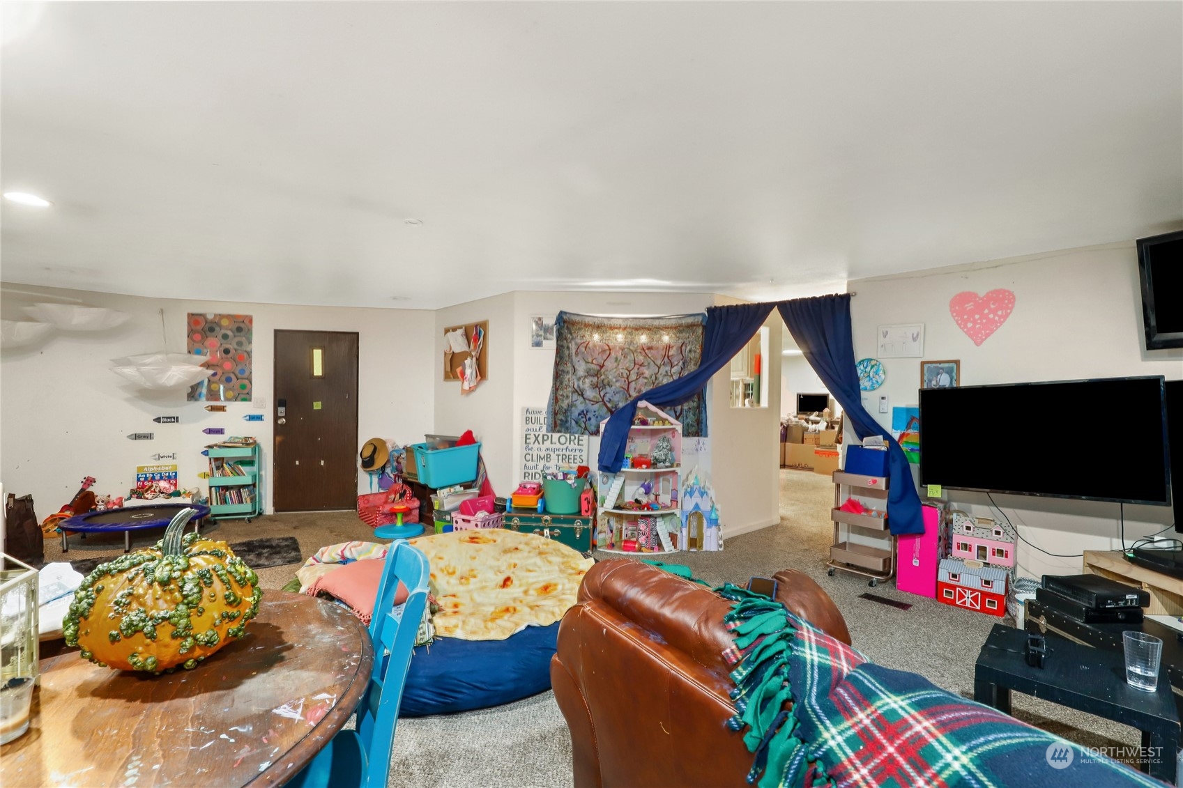 10909 Sidney Road Southwest Port Orchard, WA 98367 - Photo 3 of 34 a living room with furniture and a flat screen tv