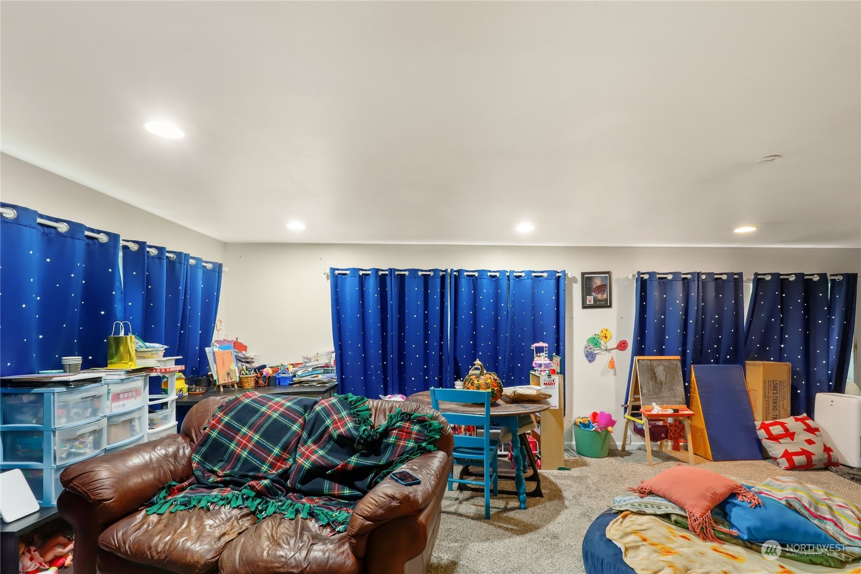 10909 Sidney Road Southwest Port Orchard, WA 98367 - Photo 4 of 34 a bed room with furniture and a chair