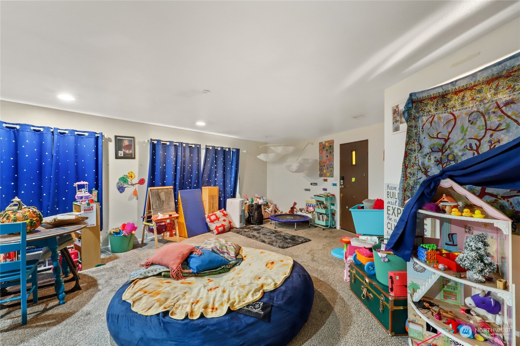 10909 Sidney Road Southwest Port Orchard, WA 98367 - Photo 5 of 34 a bed room with furniture and a chair