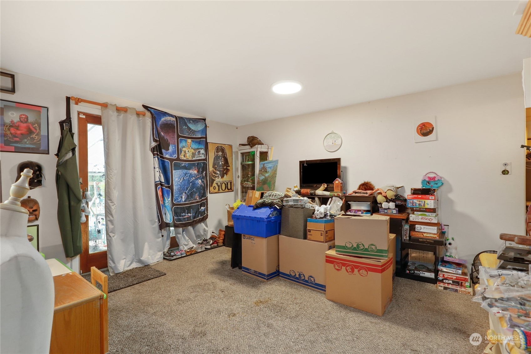10909 Sidney Road Southwest Port Orchard, WA 98367 - Photo 7 of 34 a living room with furniture and a flat screen tv