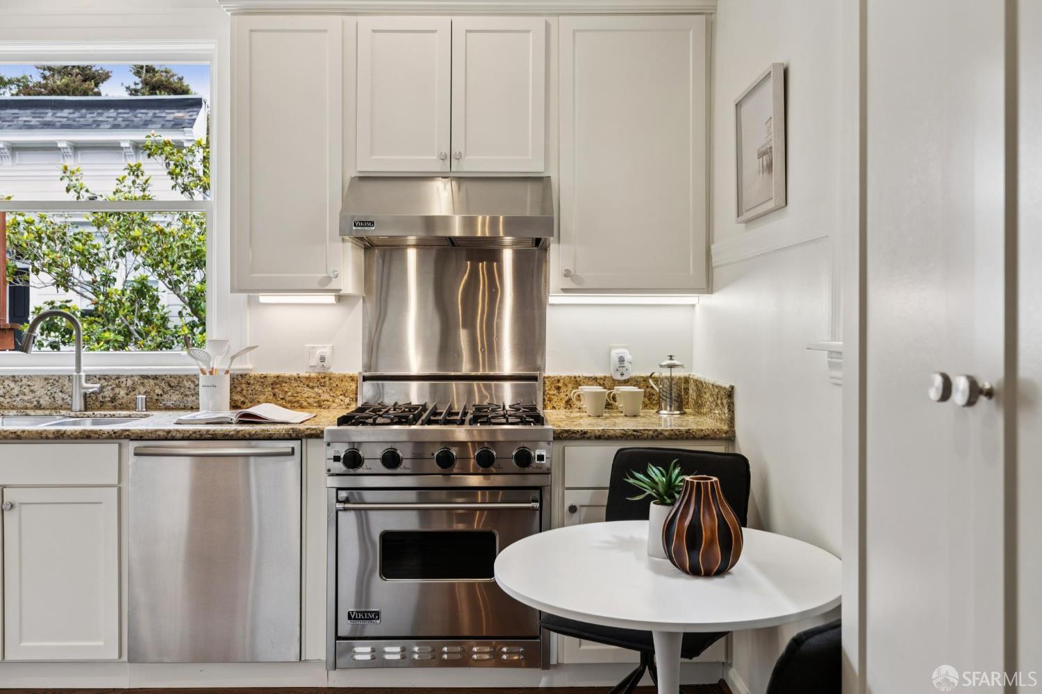 440 Laurel Street San Francisco, CA 94118 - Photo 12 of 24 a kitchen with a stove and a refrigerator