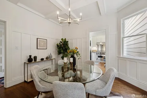 a dining room with furniture and window