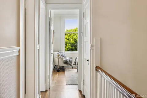 a view of a bedroom from a hallway