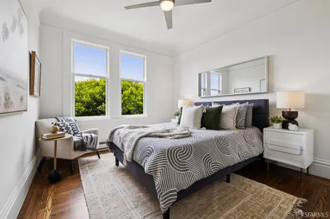 a bedroom with bed and a window