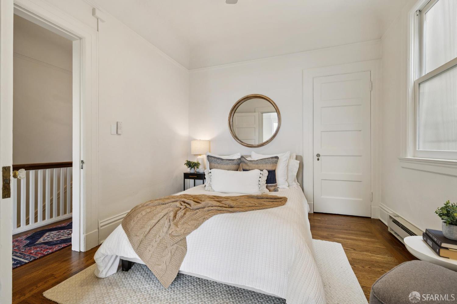 440 Laurel Street San Francisco, CA 94118 - Photo 18 of 24 a bedroom with a bed and a window